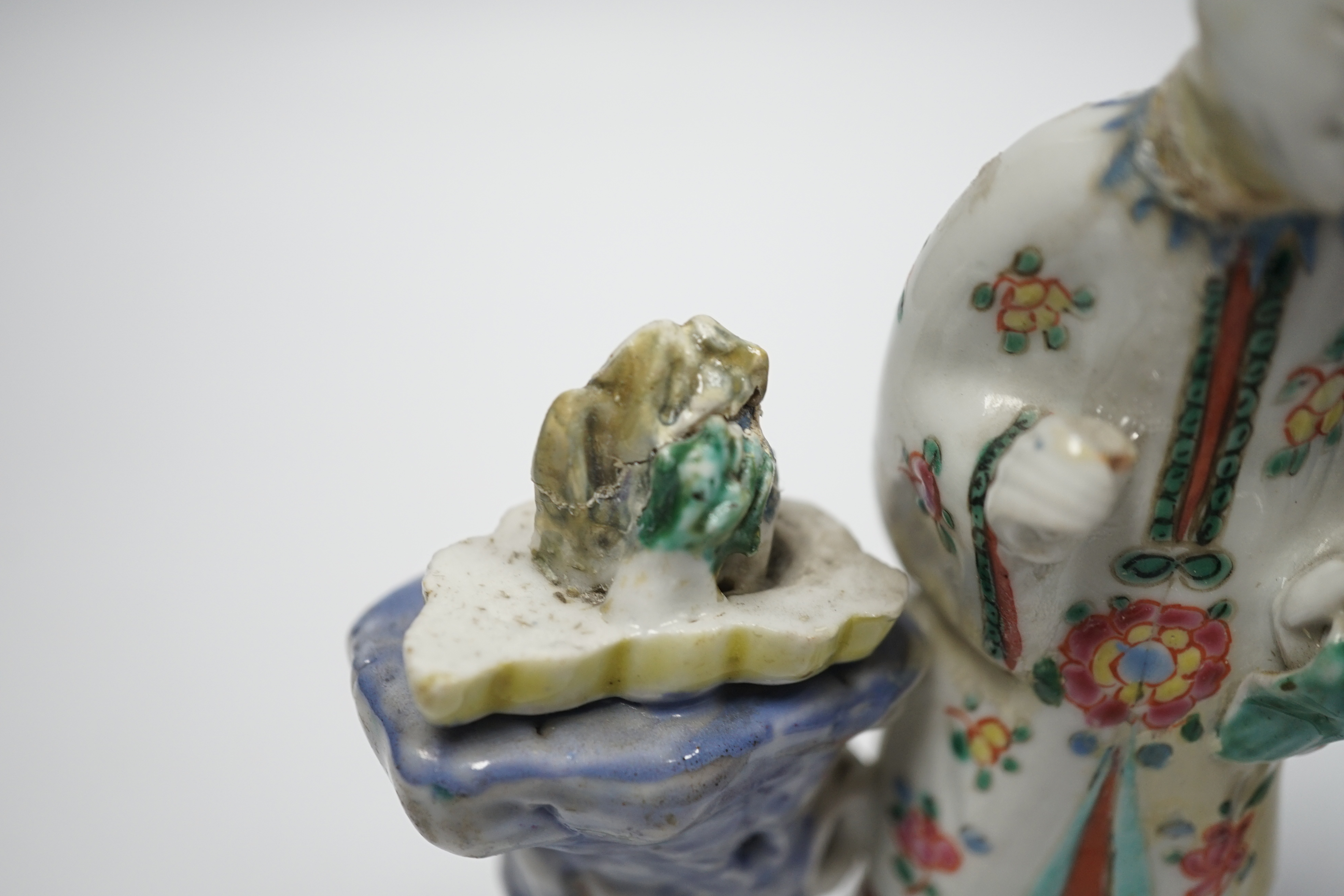An 18th century Chinese enamelled porcelain figure of a lady standing by rockwork, a similar miniature vase and a blue and white tea caddy and cover, largest 17cm high